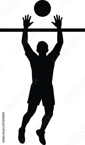 Silhouette of a volleyball player spiking the ball