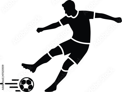 Silhouette of a soccer player kicking a ball