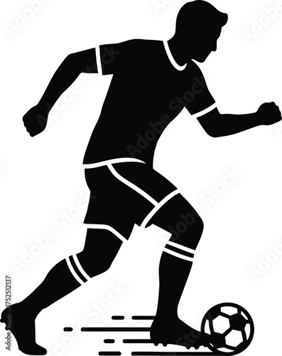 Silhouette of a soccer player dribbling a ball