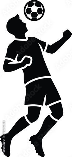 Silhouette of a soccer player heading the ball