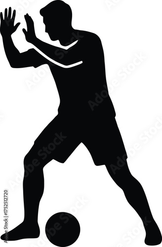 Silhouette of a soccer player defending the ball