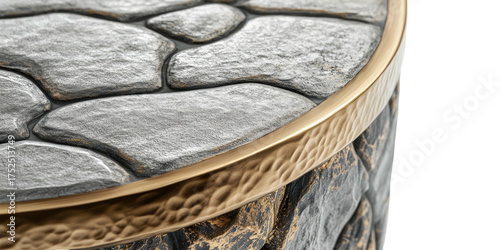 Stone-look table edge with gold trim and textured surface, close-up view