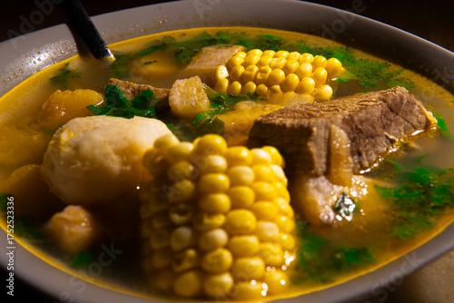 Close up of Venezuelan soup with arepa and lime, traditional Latin American cuisine