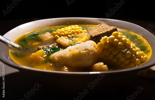 Close up of Venezuelan soup with arepa and lime, traditional Latin American cuisine