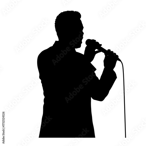 Silhouette of a man singing into a microphone on stage for a performance or speech.