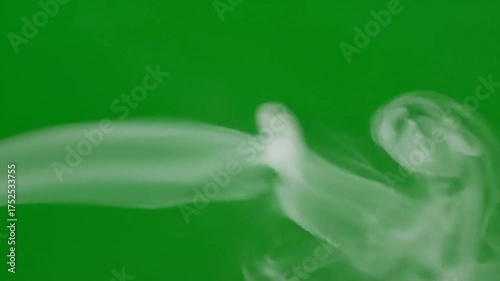White Smoke Swirls Against a Vibrant Green Screen Background Motion Graphics and Visual Effects Element