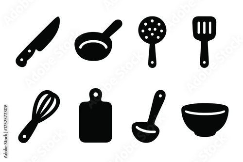 Kitchen tools and utensils for cooking and food preparation displayed on a clean background