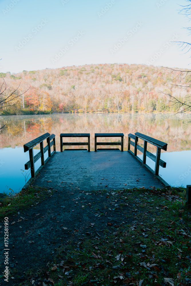 Fototapeta premium Beautiful Autumn Forest with Mountain Fog and A Lake