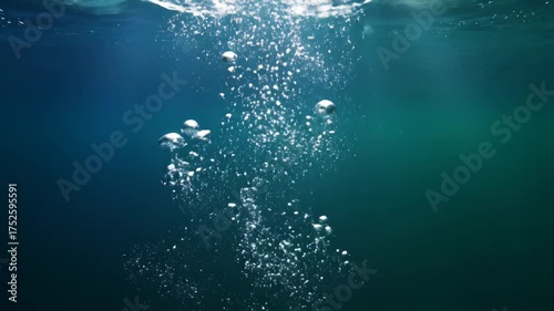 Underwater Bubbles Ascending in Deep Blue Sea - A Serene Visual Journey.