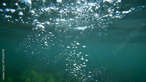 Bubbles rising from the depths of the ocean.
