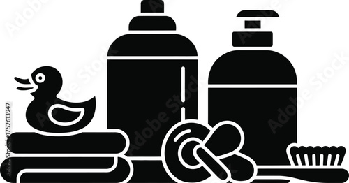 Baby bath time essentials including rubber duck towels soap and brush