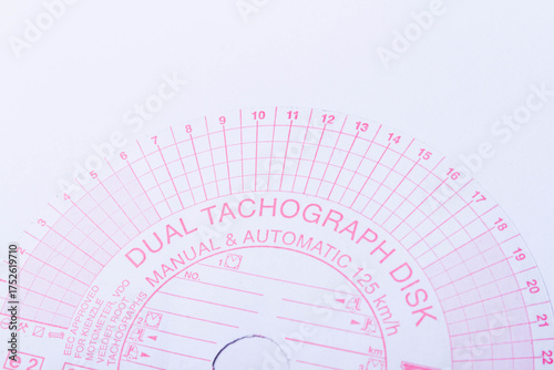 Tachograph. Driver time tracking. Fixing the movement of the car. Cargo transportation with driving according to the schedule. Time disk. Background from recorded analog tachograph disks.