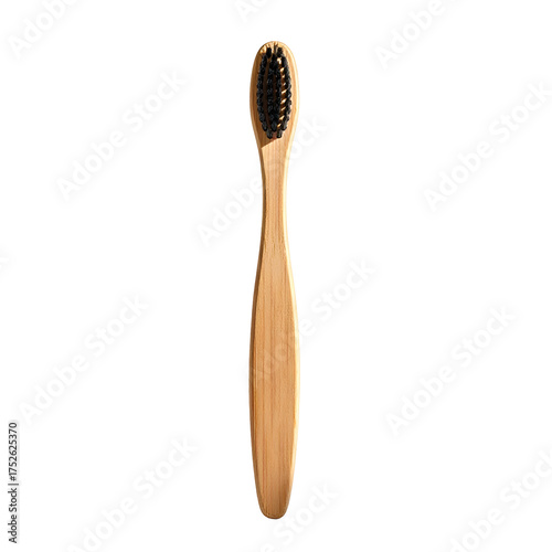 Wooden toothbrush with black bristles on a dark background.