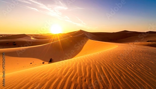 Vivid Desert Landscape with Golden Sunset Light Casting Warm Glow on Sand Dunes Under Clear Sky with Geometric Pattern Overlay