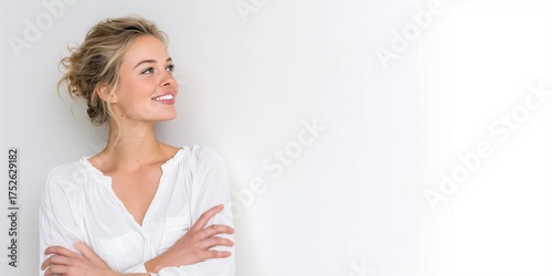 Model's head raised and looking forward,smiling,arms crossed,copy space,white background,banner