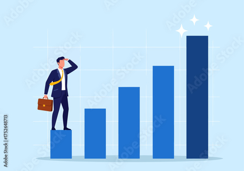 Businessman on a rising bar chart symbolizing career growth and future success (SKF00001)