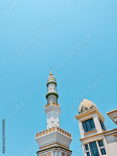 minaret of the mosque under blue sky