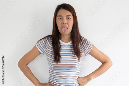 A Playful Expression Featuring a Tongue Sticking Out A Casual Portrait of Joyful Moments