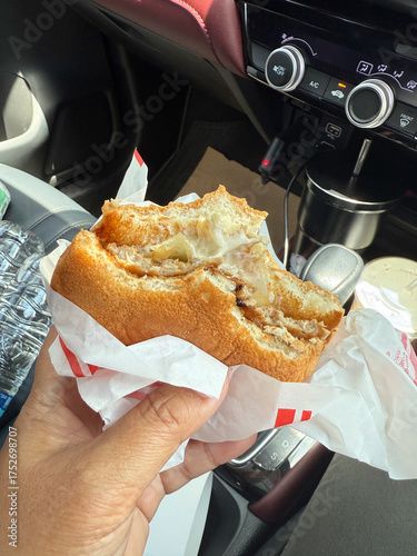 A Samurai Burger with bite marks on it.