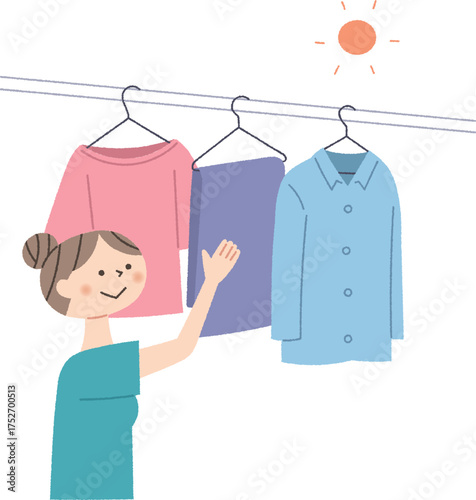 洗濯物を干す女性