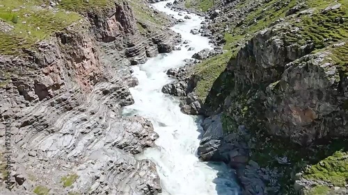 Aerial View of a Raging Mountain River in a Rocky Canyon.