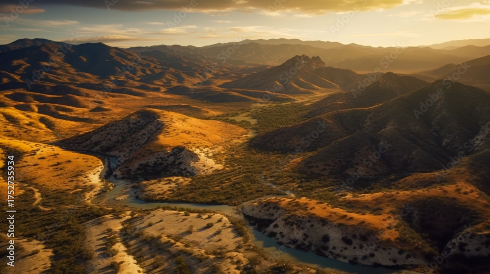 Fototapeta premium Vibrant landscape showcasing rolling hills, valleys, and a winding river during golden hour in a mountainous region