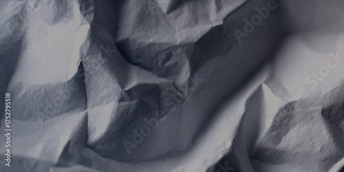 Abstract dark crumpled black paper texture background.