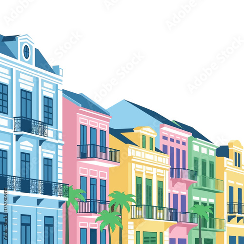 Colorful row of buildings with balconies and palm trees in front.