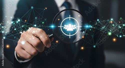 Professional businessman targets ideal clients with magnifying glass, network connections