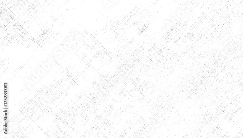 A white background with a subtle pattern of scattered dark speckles and faint diagonal lines.