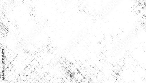 A white surface with scattered dark gray speckles and diagonal line patterns creating a distressed texture.