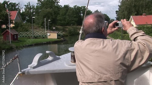 Tourists Enjoying the View Aboard a Boat on Göta Canal, Sweden
