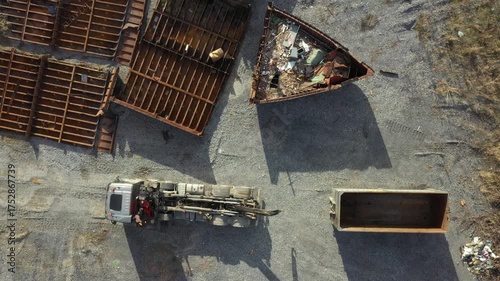 Above view on tow truck as he pull on mobile container for transportation metal.