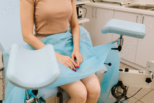 Canvas Print Modern gynecological chair and microscope ready for gynecology exam
