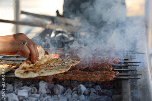 Canvas Print grilling adana kebap which is made from minced lamb meat