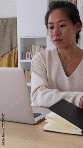 Young asian businesswoman working from home office