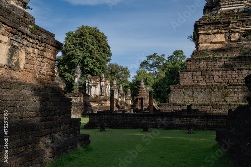 A large courtyard with a grassy area in the middle