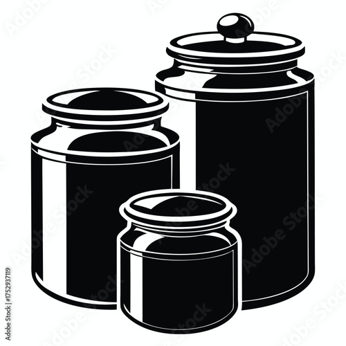 Black canister set displays three canisters of varying sizes on a plain white setting