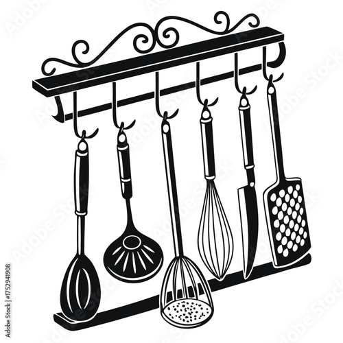Black wrought iron rack displays hanging utensils like a ladle, spatula, whisk, and knife
