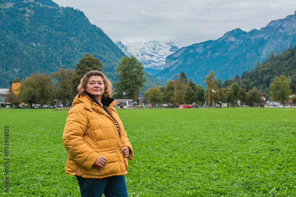 Naklejka premium Middle aged woman enjoying European vacation. Travel lifestyle 50+