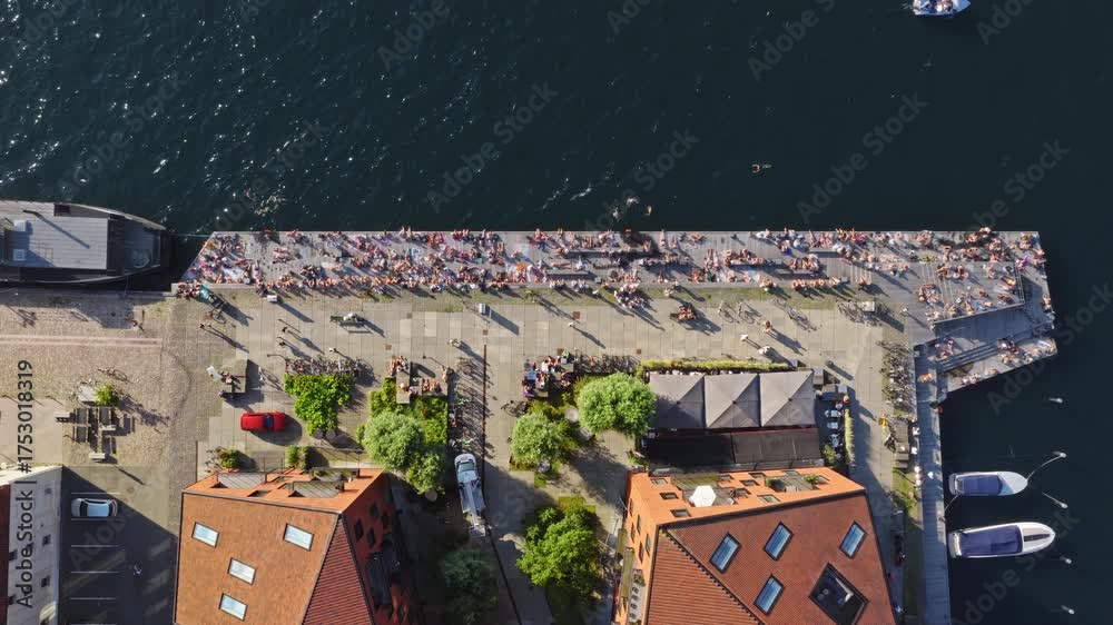 Aerial Drone View Of People Sunbathing And Swimming Along The Lively aerial-drone-view-of-people-sunbathing-and-swimming-along-the-lively