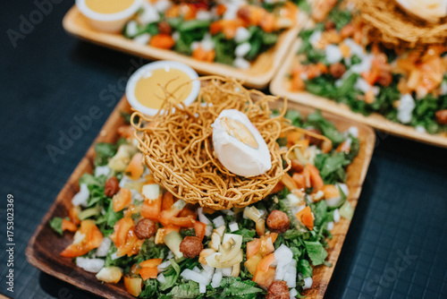 Crispy Pancit Lucban Noodle Nest with Soft-Boiled Egg on Fresh Vegetable Salad in Lucban, Quezon Province, Philippines