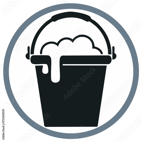 Clean bucket filled with overflowing soap suds and water for washing purposes