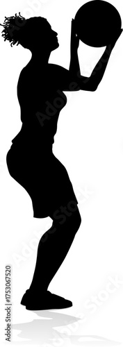 Silhouette of athletic woman female basketball player with basketball ball. Sports concept.