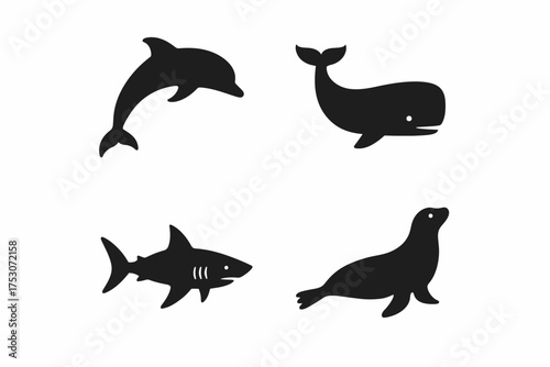 Silhouettes of dolphin, whale, shark, and seal in simple illustration