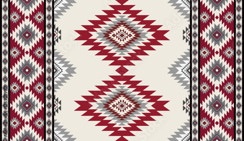 Seamless geometric ethnic pattern inspired by Native American tribal fabric. Traditional Aztec and Navajo style carpet and tile vector design on navy blue background. Perfect for textile, wrapping,