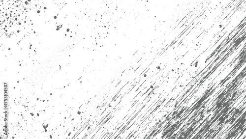 Abstract grey splatters and scratches on a white background creating a distressed texture.