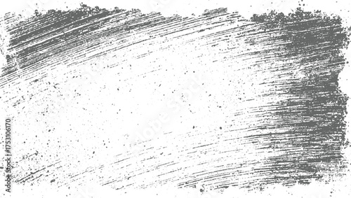 A distressed gray brush stroke texture with scattered dark dots on a white background.