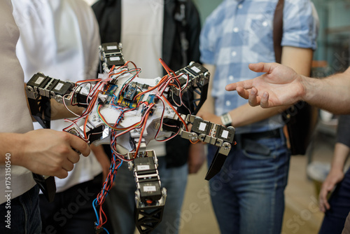 Students present hexapod robot prototype during STEM workshop