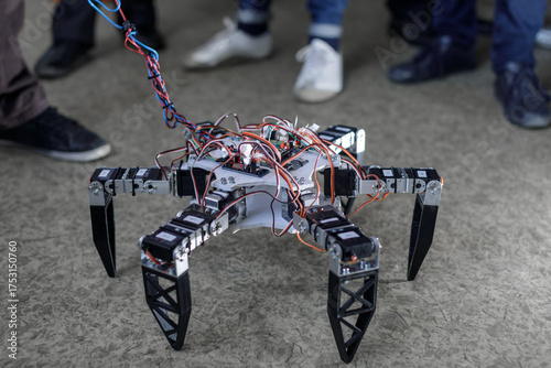 Hexapod robot prototype on classroom floor during STEM robotics workshop